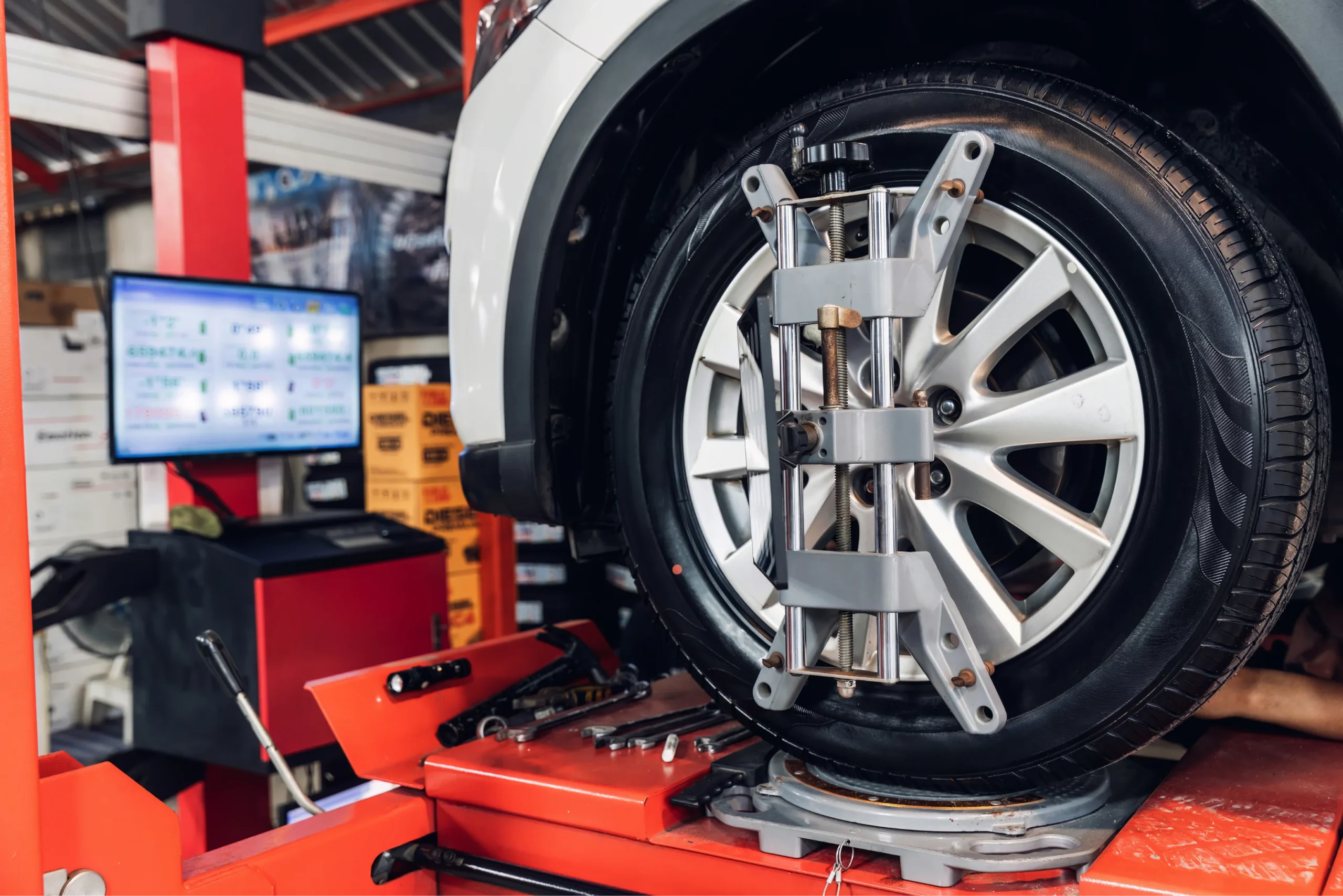 Close-up of wheel alignment clamp equipment